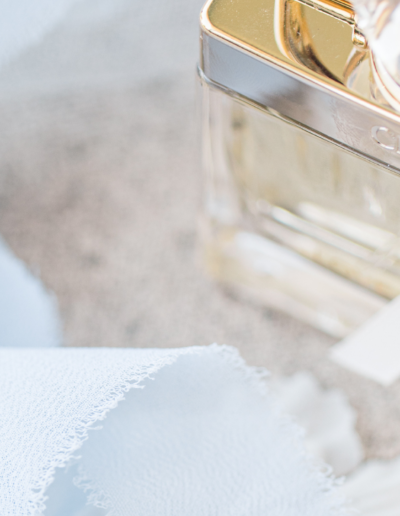 Up close image of a ribbon and perfume on the day of a wedding
